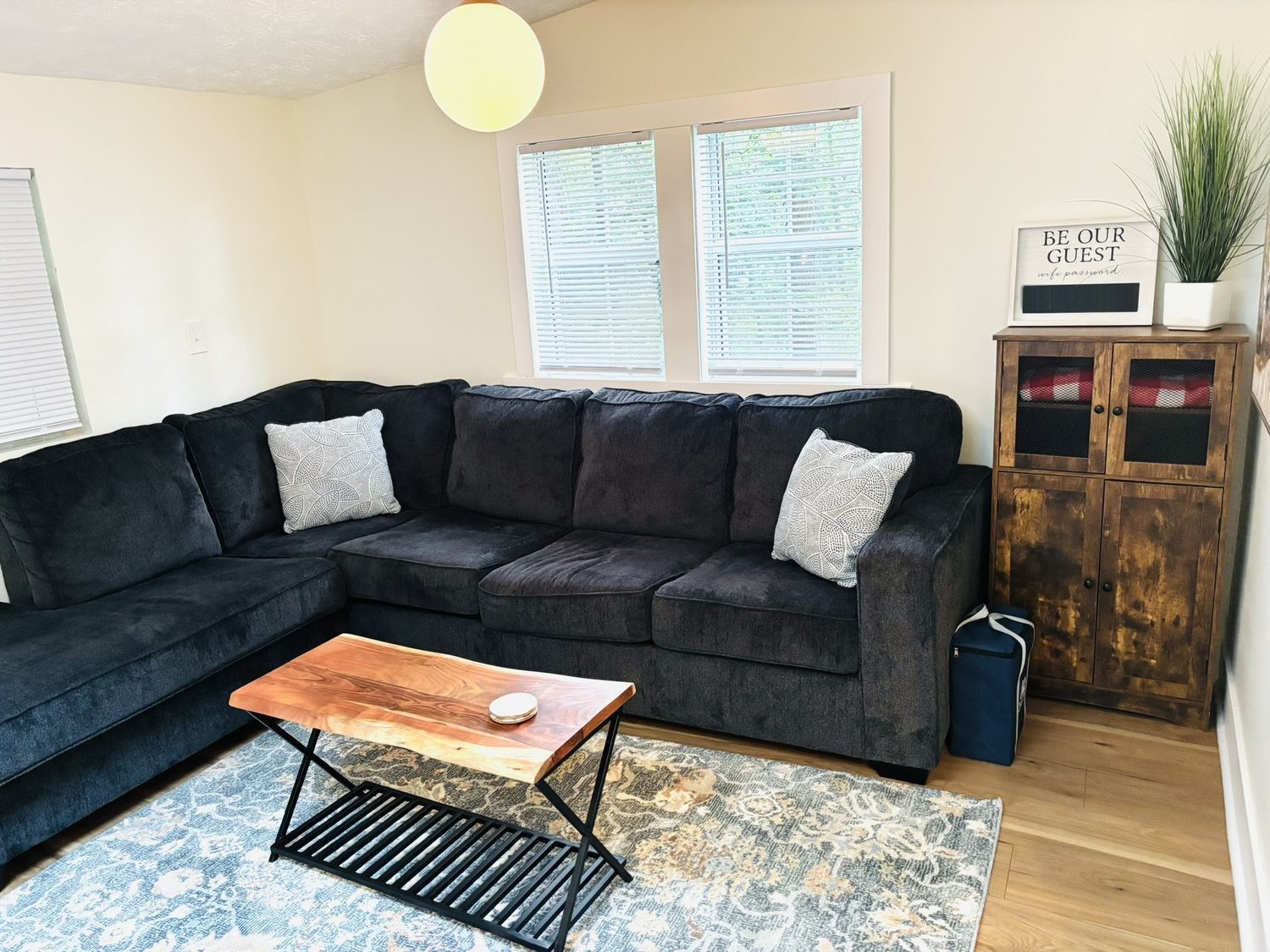 Living room with a deep sectional sofa and patterned rug